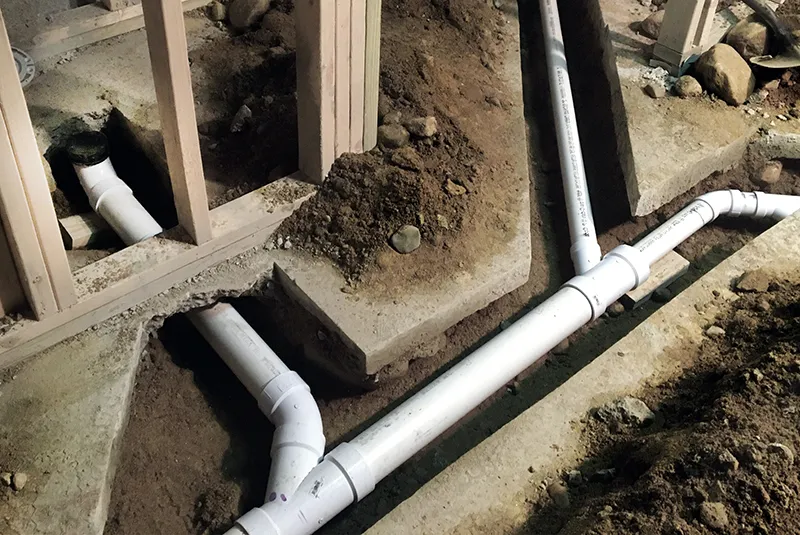 Professional PVC pipe installation for a sewer tie-in, handled by Prime Plumbing Services, expert basement plumbing contractors Edmonton.